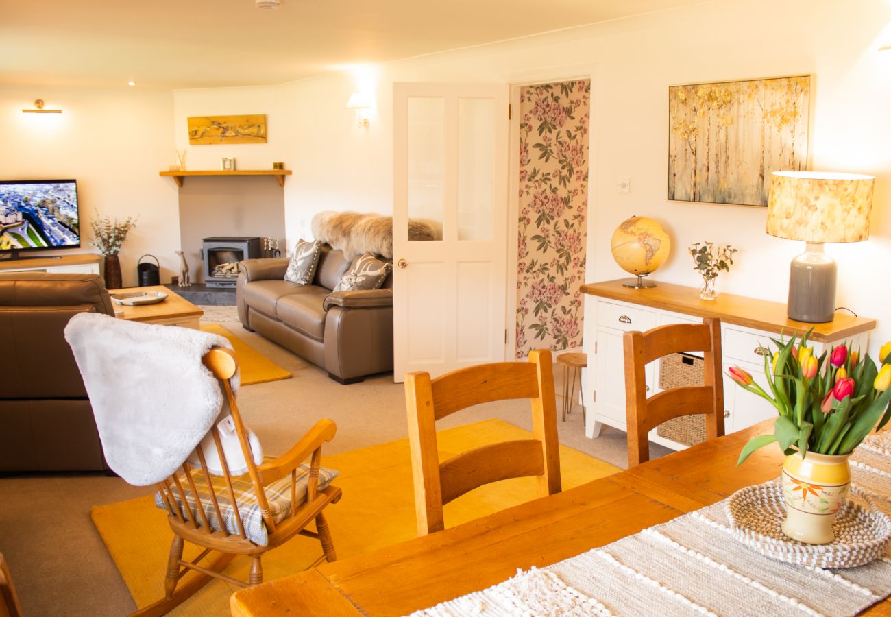  Dining table and lounge in an Inverness holiday cottage