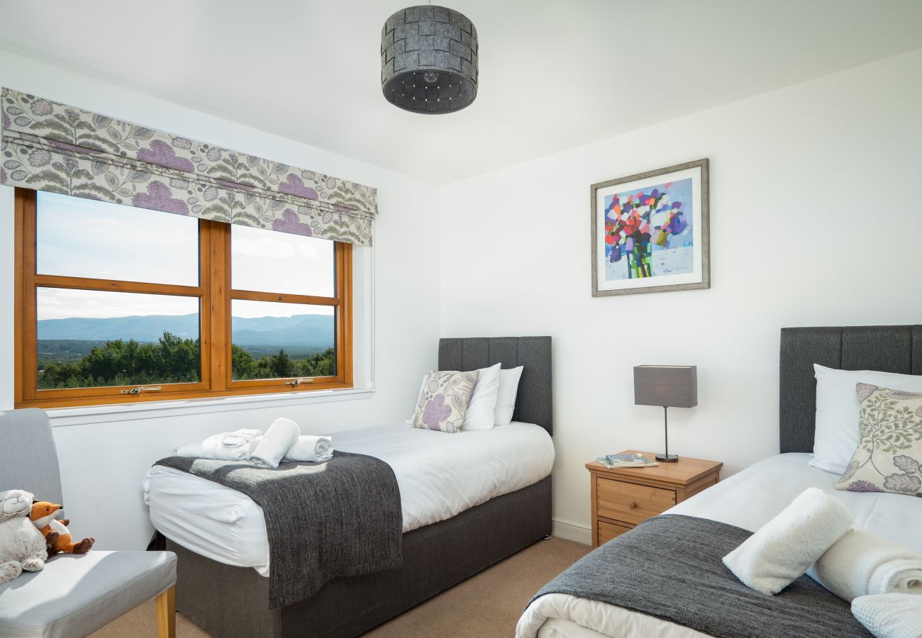 Twin room in a lodge with view over Aviemore