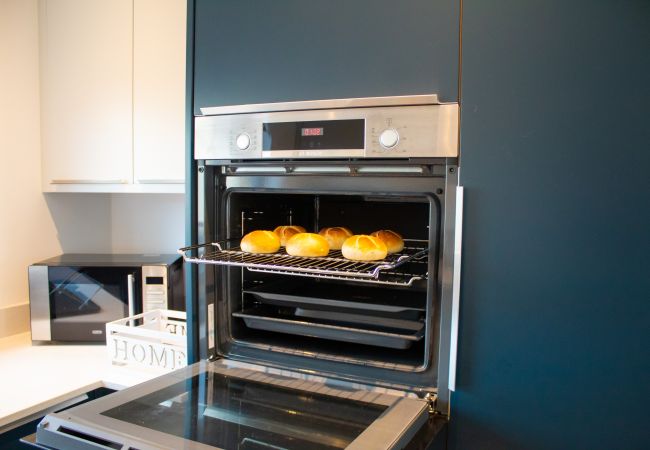Oven in modern kitchen in a self catering property in Aviemore