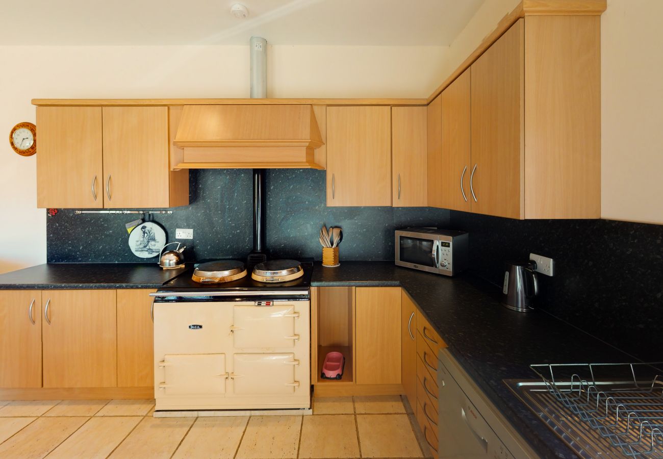 Country kitchen with range cooker in Cairngorm holiday cottage