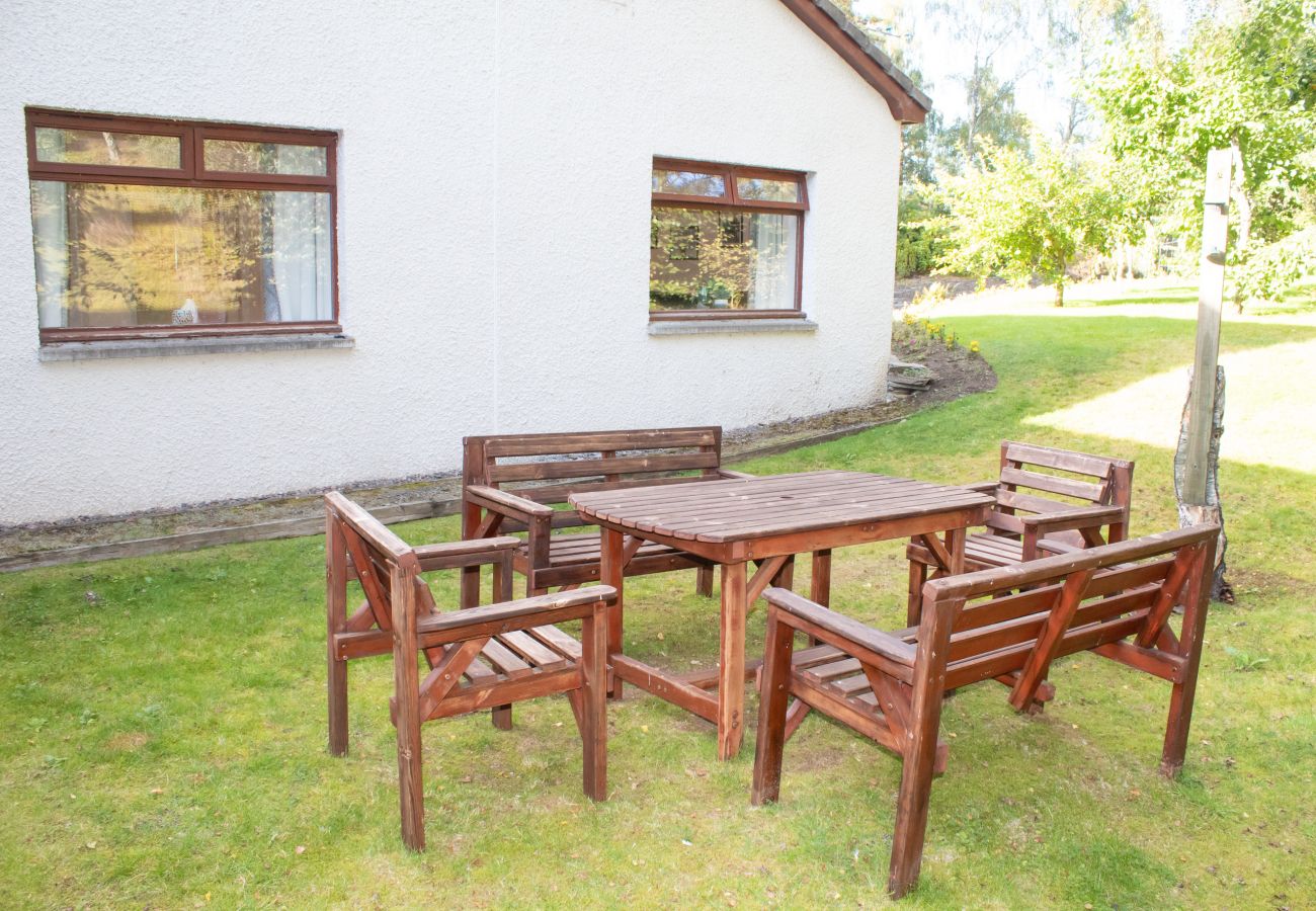 Outdoor seating in garden at a Cairngorm holiday cottage