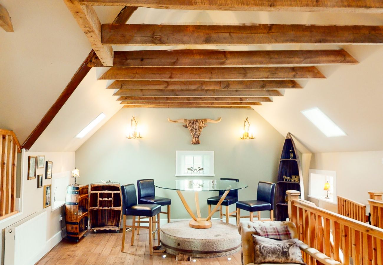 Open plan living space in The Maltings - a converted mill that is now a luxury holiday lodge.