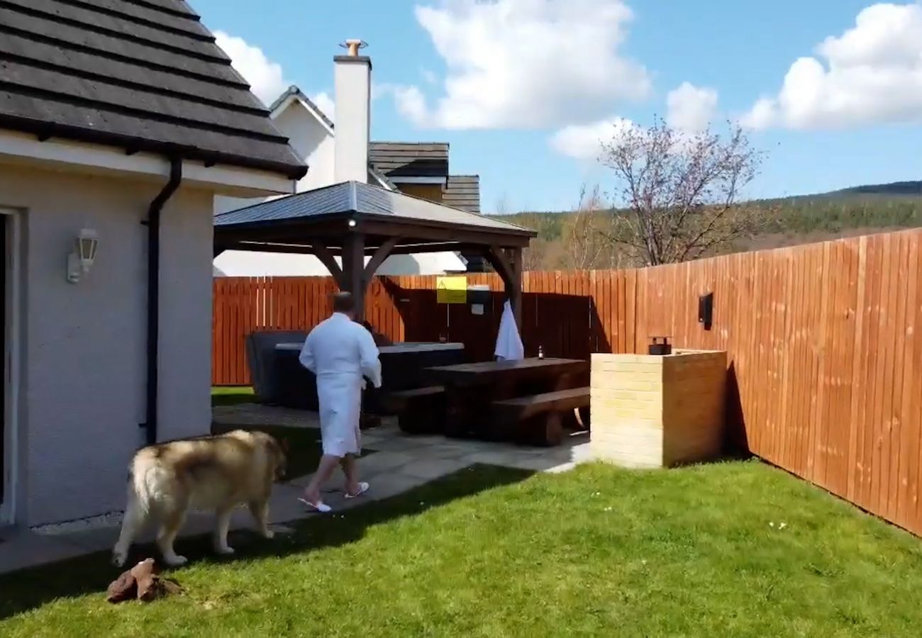 Hot tub and BBQ in an enclosed garden at Eagle Lodge , Aviemore