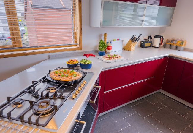 Cooking in Aviemore holiday home kitchen