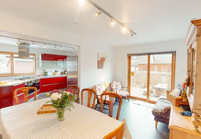 Open plan kitchen and dining space in an Aviemore lodge