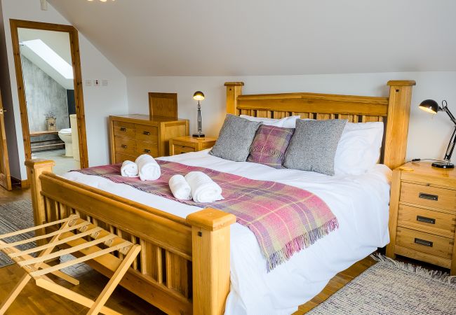 King bed in an Aviemore holiday lodge