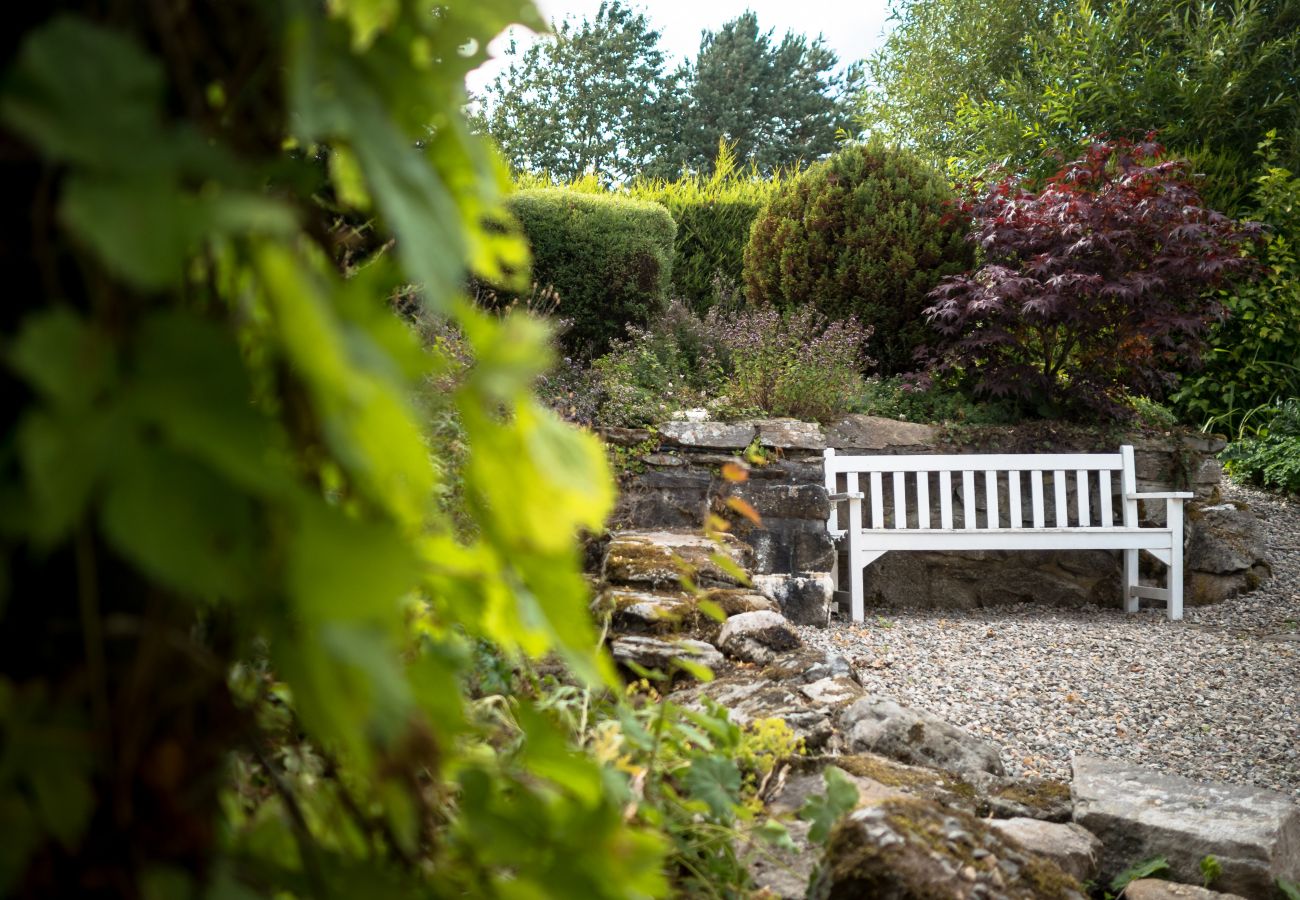 Bench in the garden of a Cairngorm holiday lodge