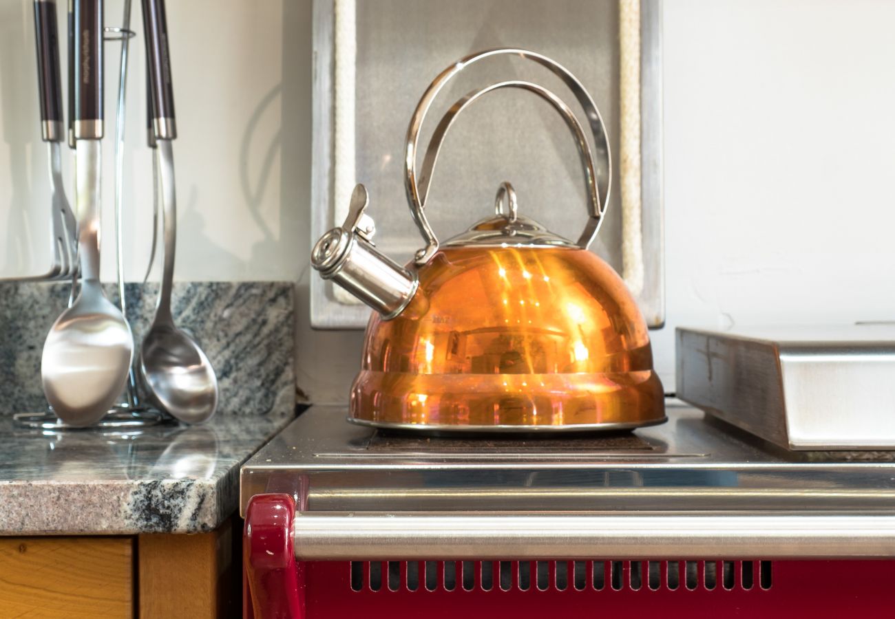Kettle on the hob of a country kitchen in a Highland lodge