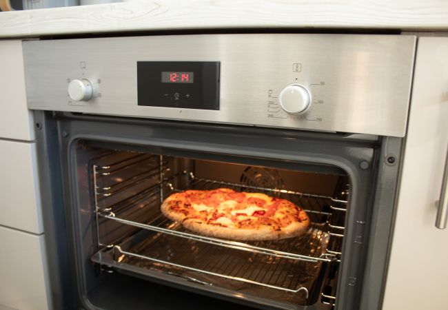 Pizza in oven at 4 Bynack