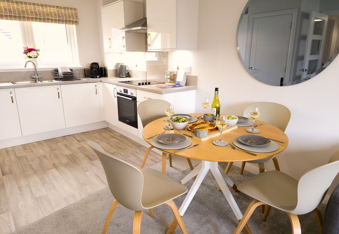 Open plan kitchen and dining space in an Aviemore holiday let