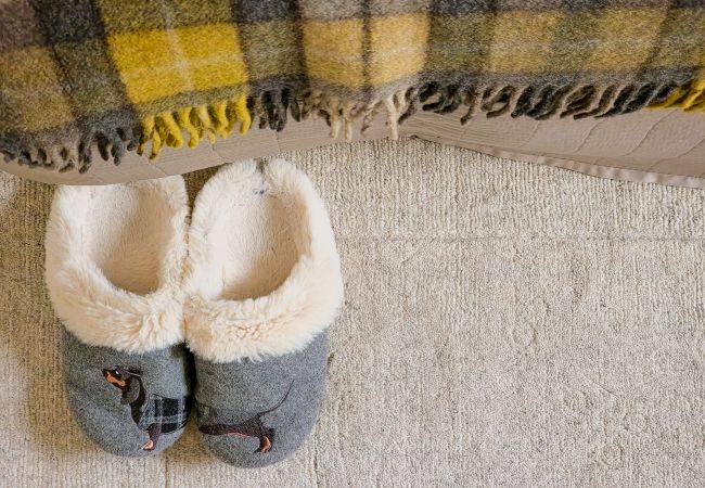 slippers by the bed at The Bothy