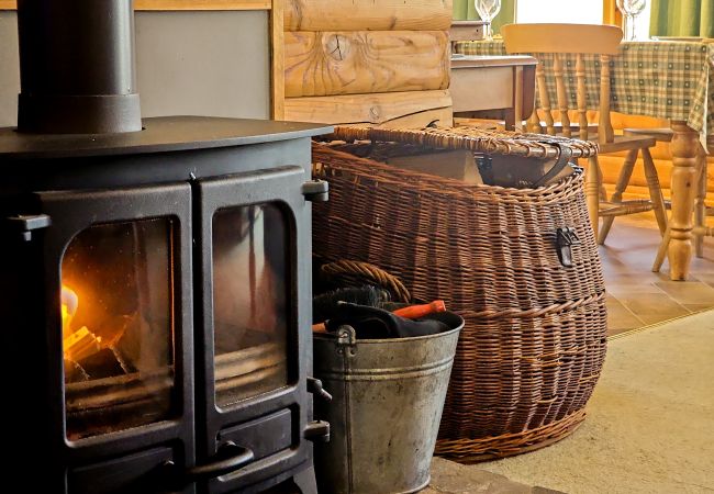 Log burner in a Cairngorm log cabin