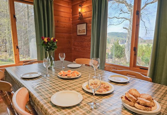 Dining space with view over Highland scenery