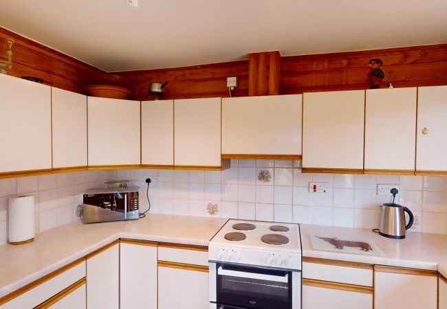 Kitchen with dishwasher and electric oven