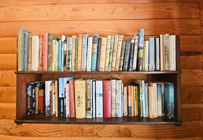 Books in a log cabin in Scotland
