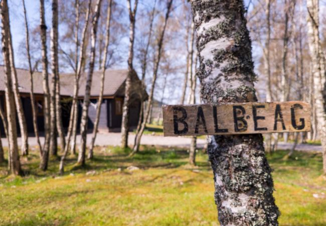 A sign for Balbeag log cabin