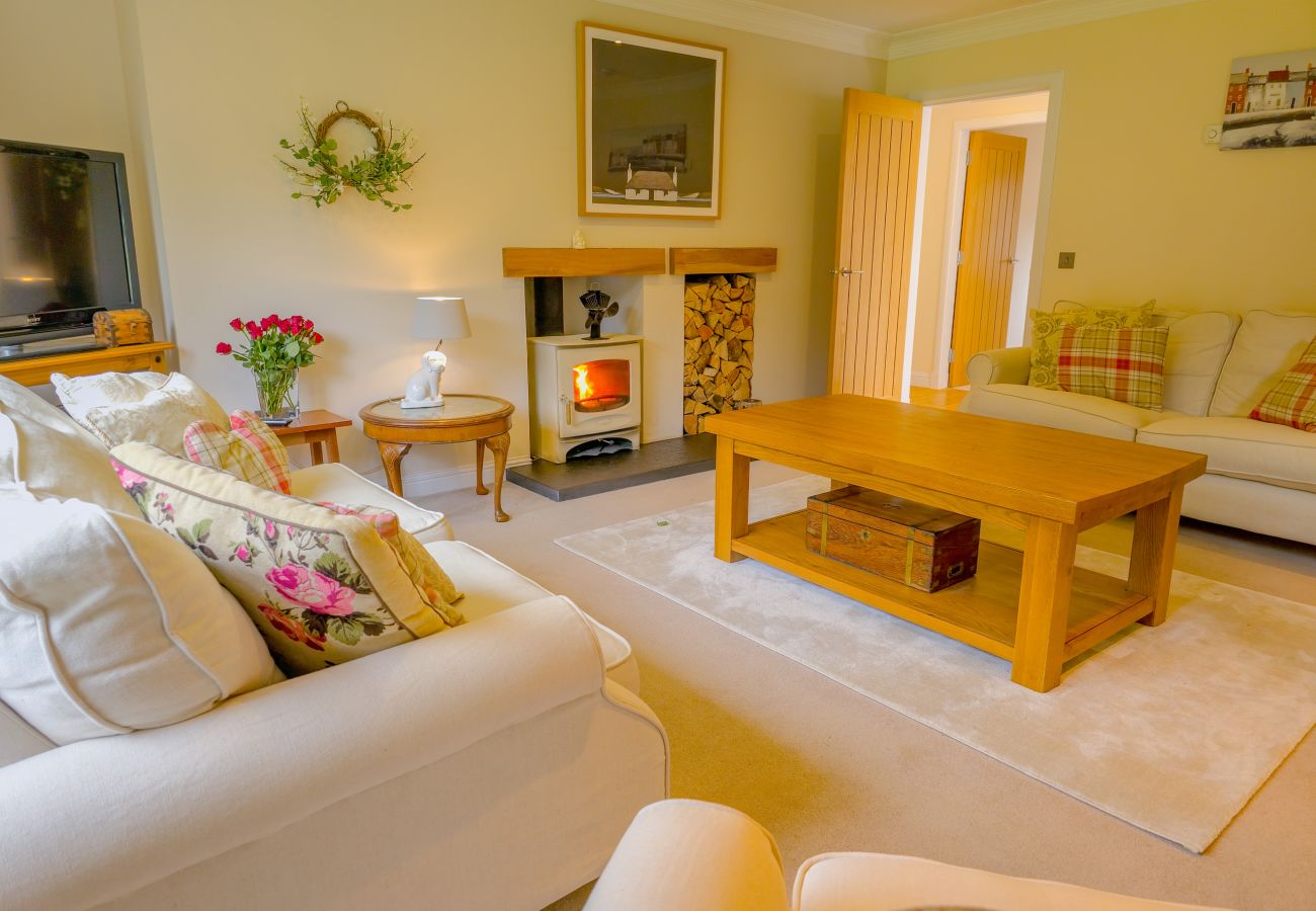 The living room with wood burning stove at The Bellhouse