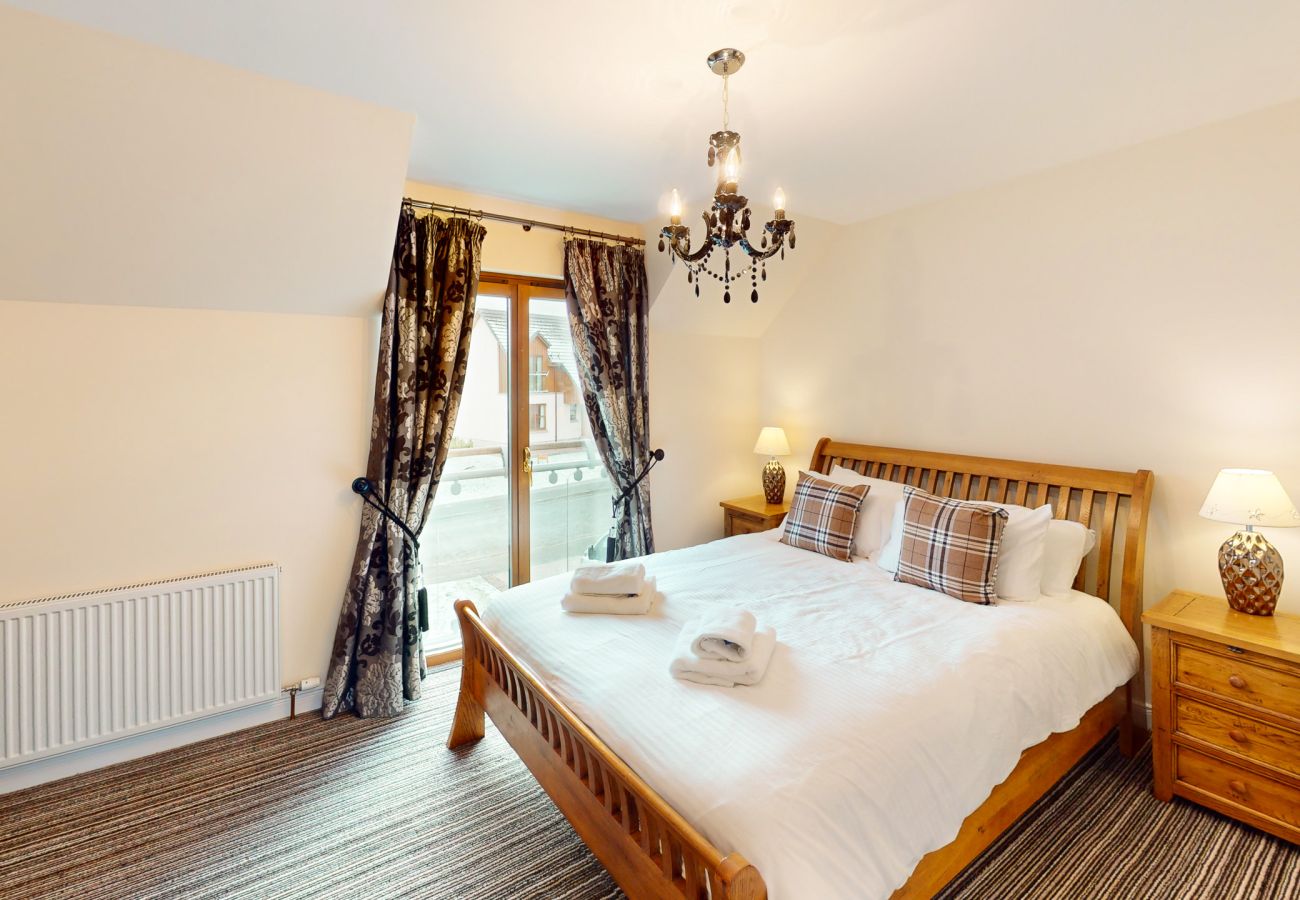 Master bedroom with ensuite in an Aviemore holiday lodge