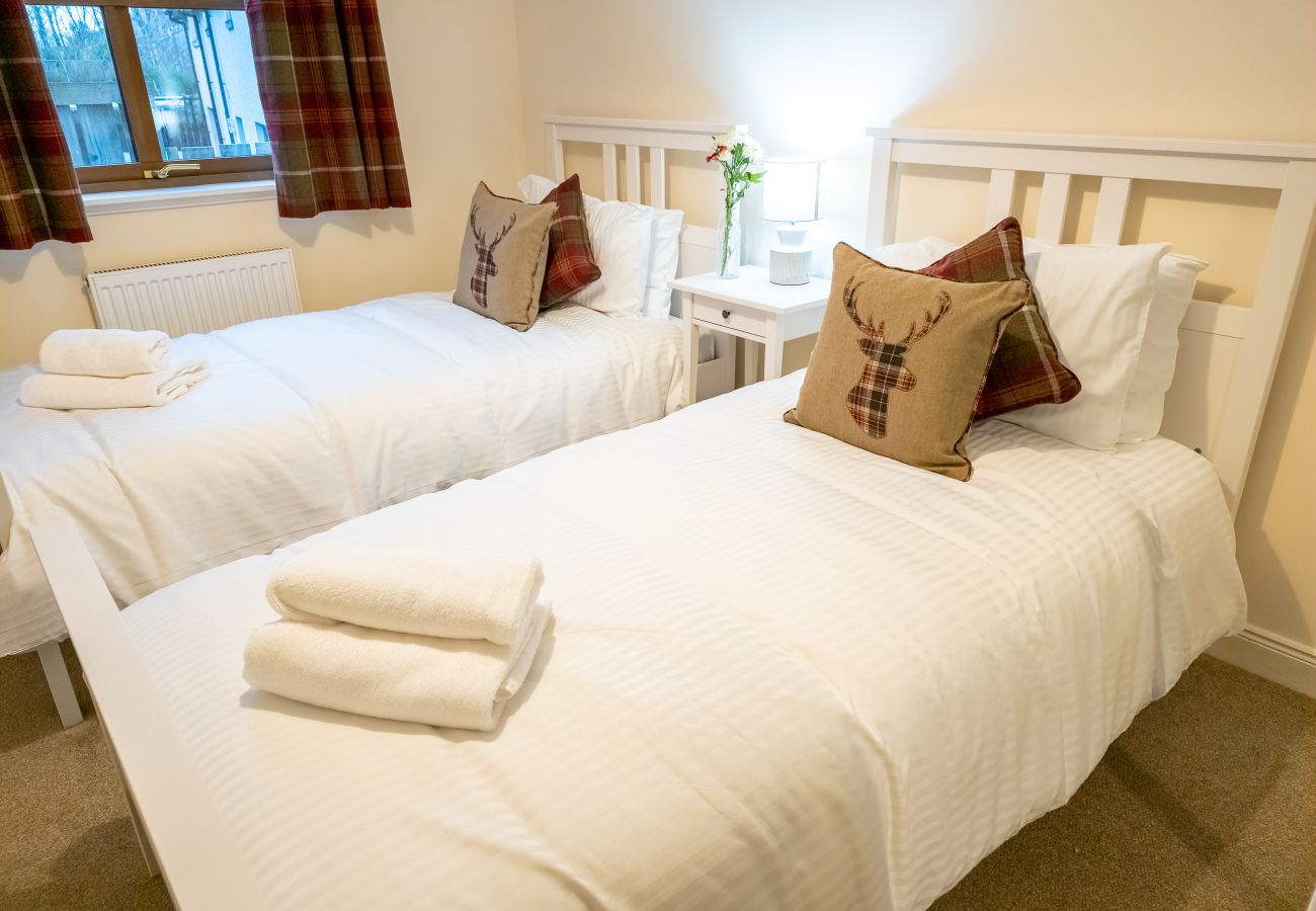 A twin room in a 4 bedroom Aviemore holiday lodge