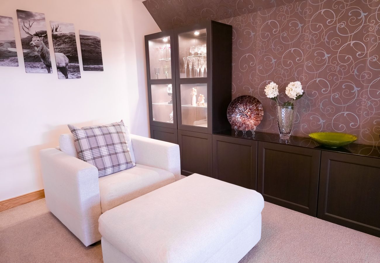 Living Room with luxury furnishings in an Aviemore Holiday Home