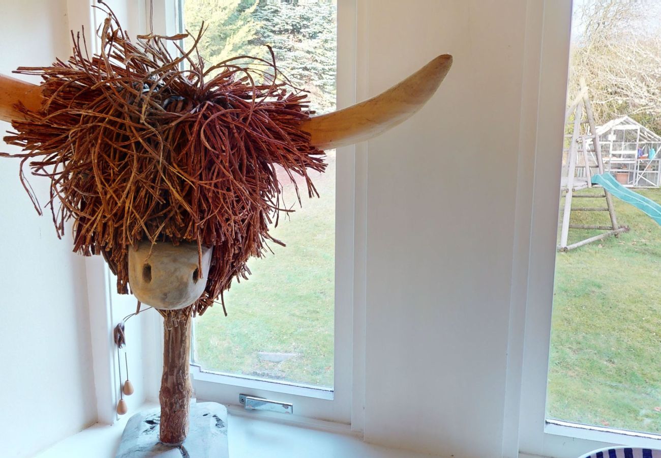 A Highland cow ornament in a Laggan holiday home