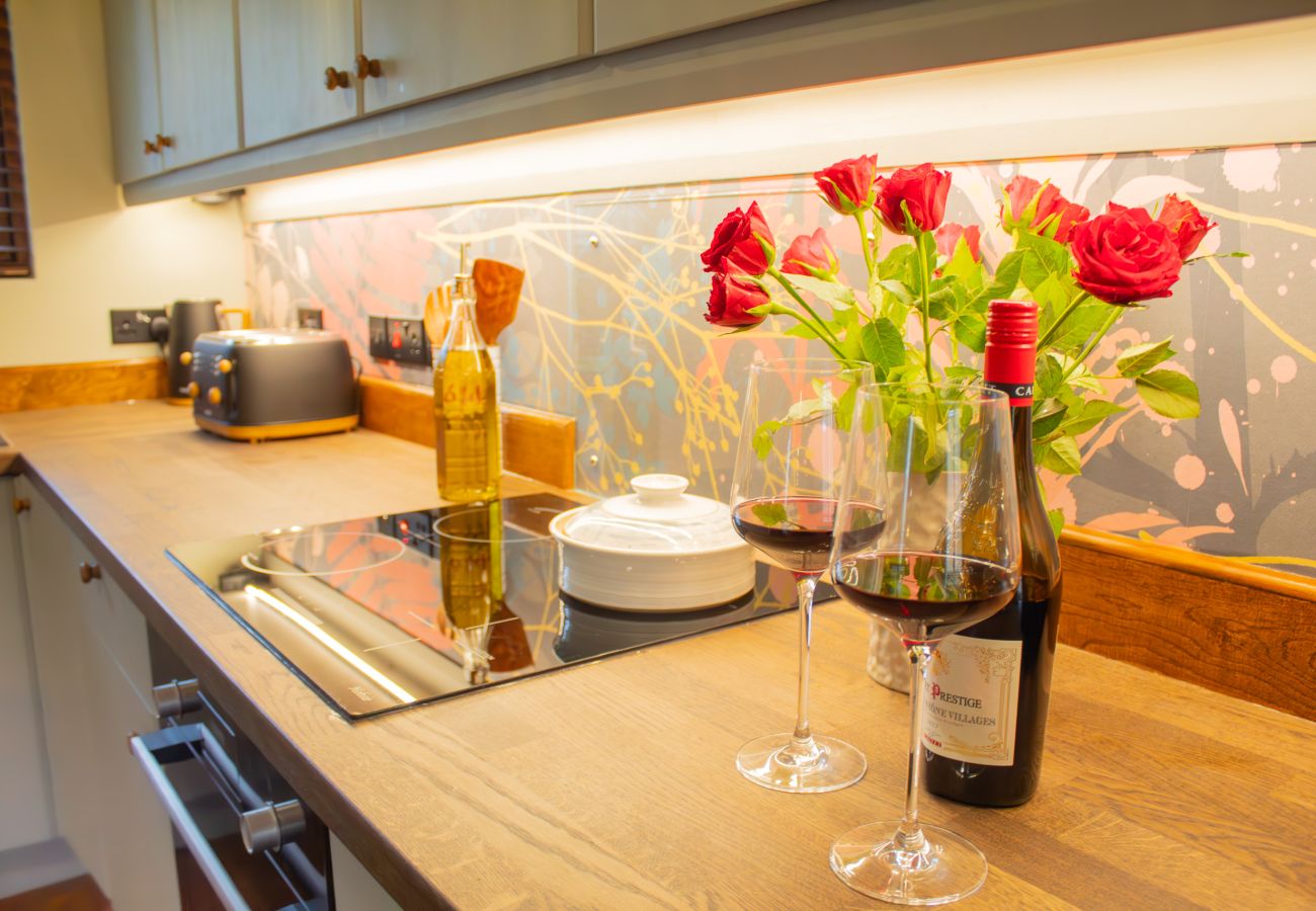 Wine and flowers in the kitchen at Telford Cottage