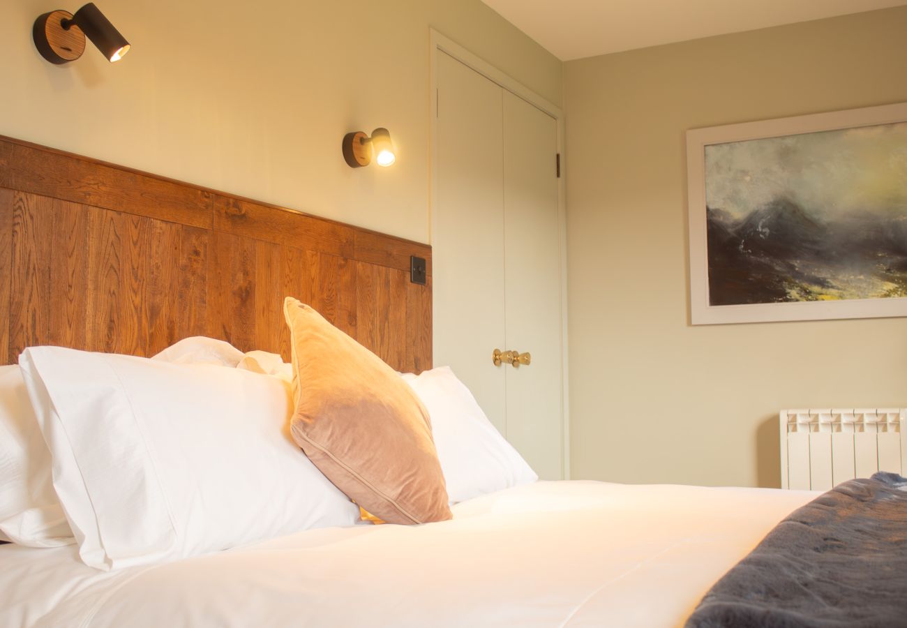 Cozy bedroom with quality linen in a holiday cottage