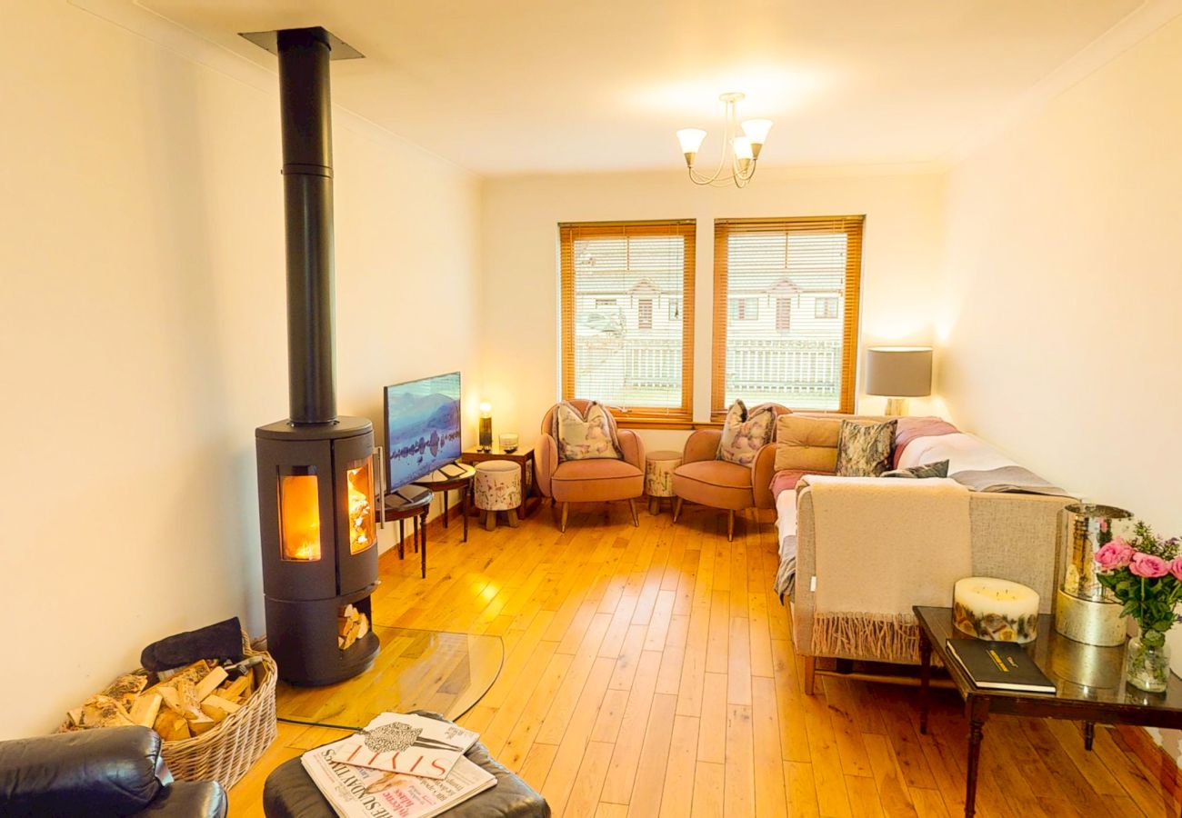 Lounge with wood burner and comfortable sofa Aviemore