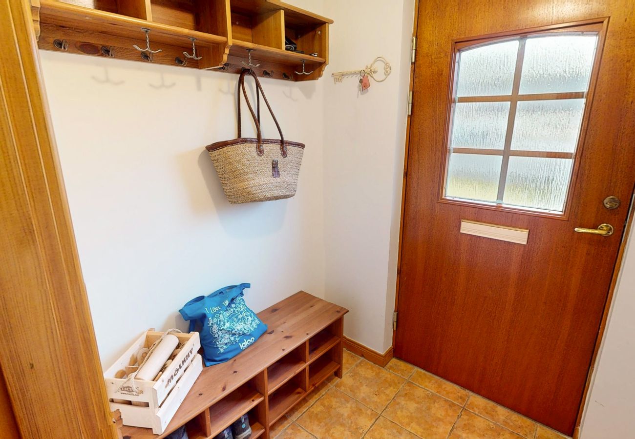 Warm wooden hallway inside Casa Amor Aviemore