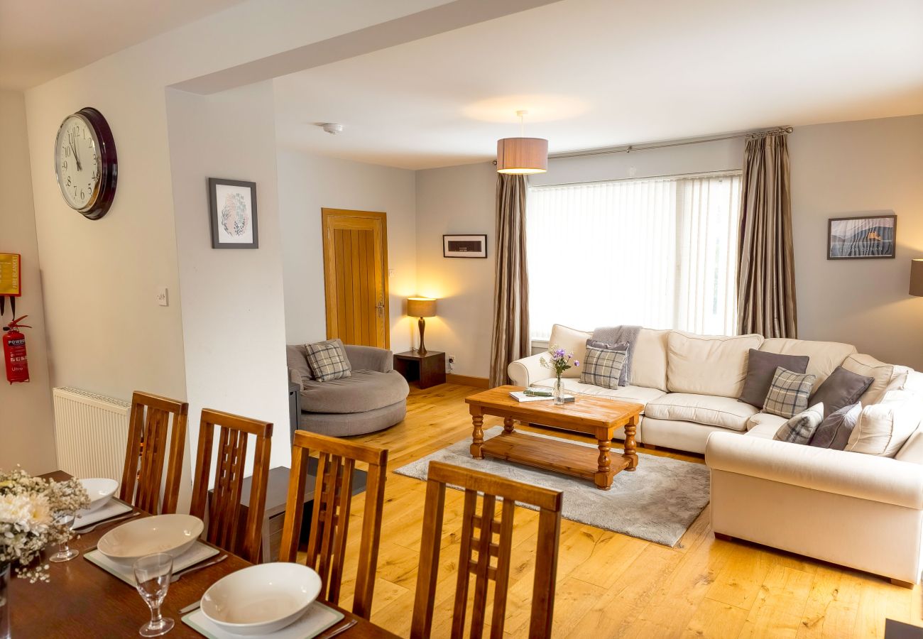 Large family lounge with sofa and dining area