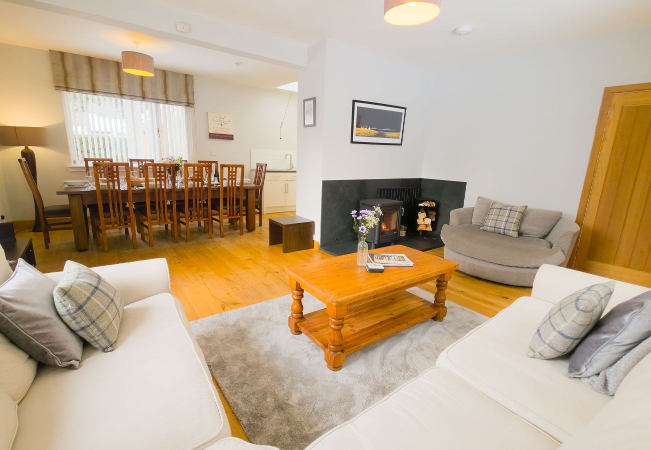 Living room with log burner and soft seating