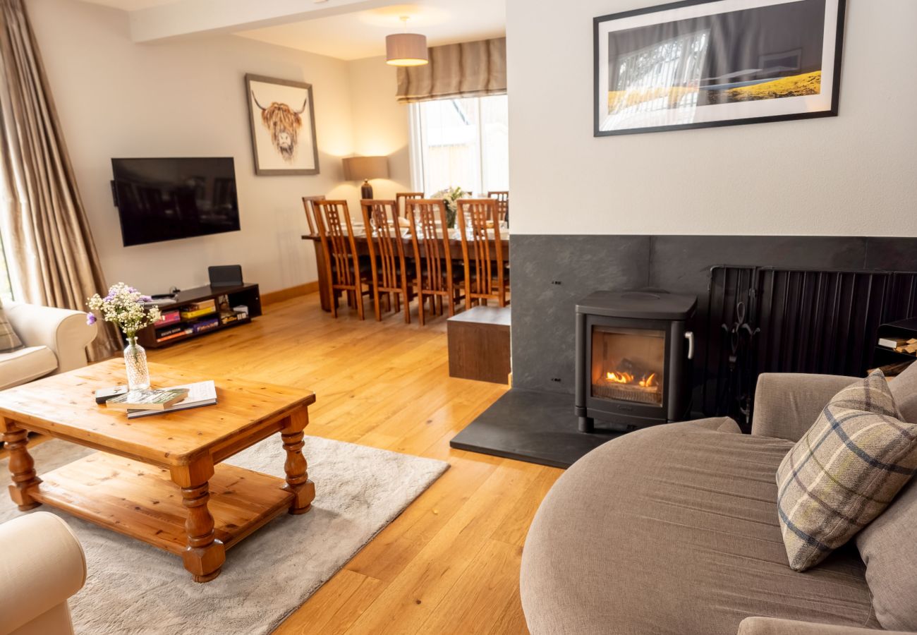 Corner sofa beside log burner