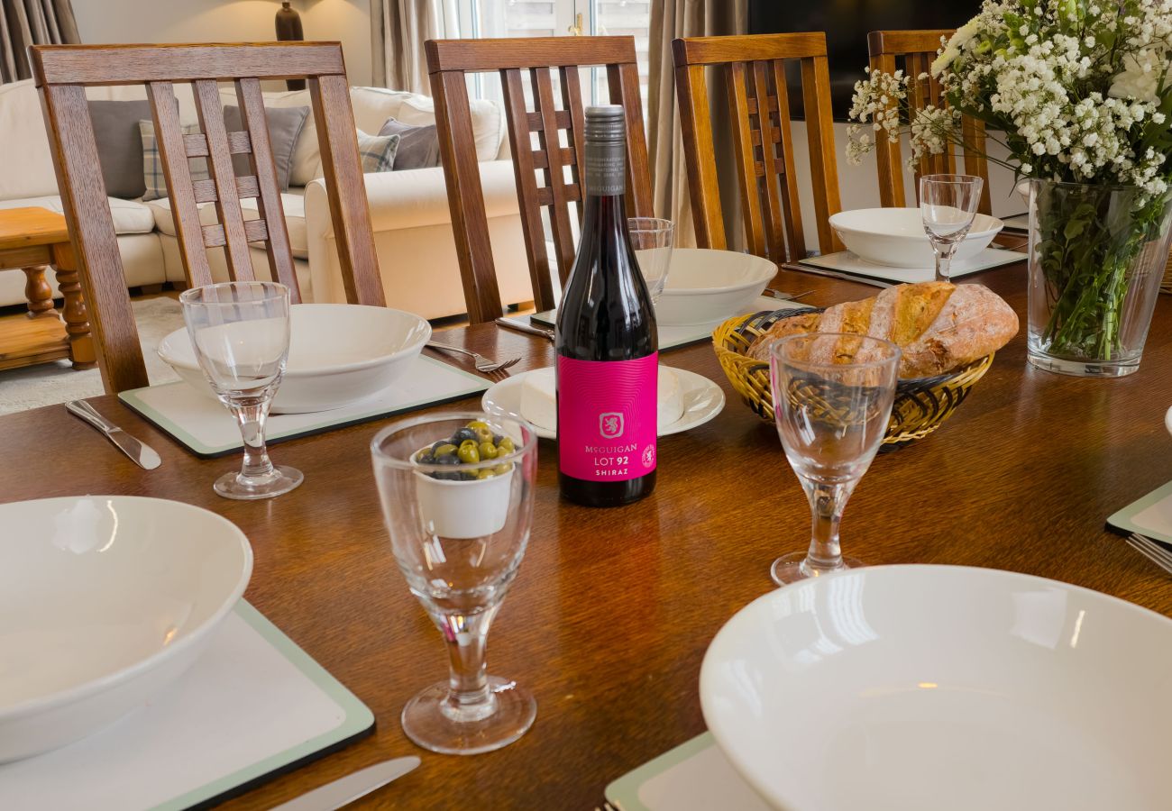 Set dining table with wine and flowers