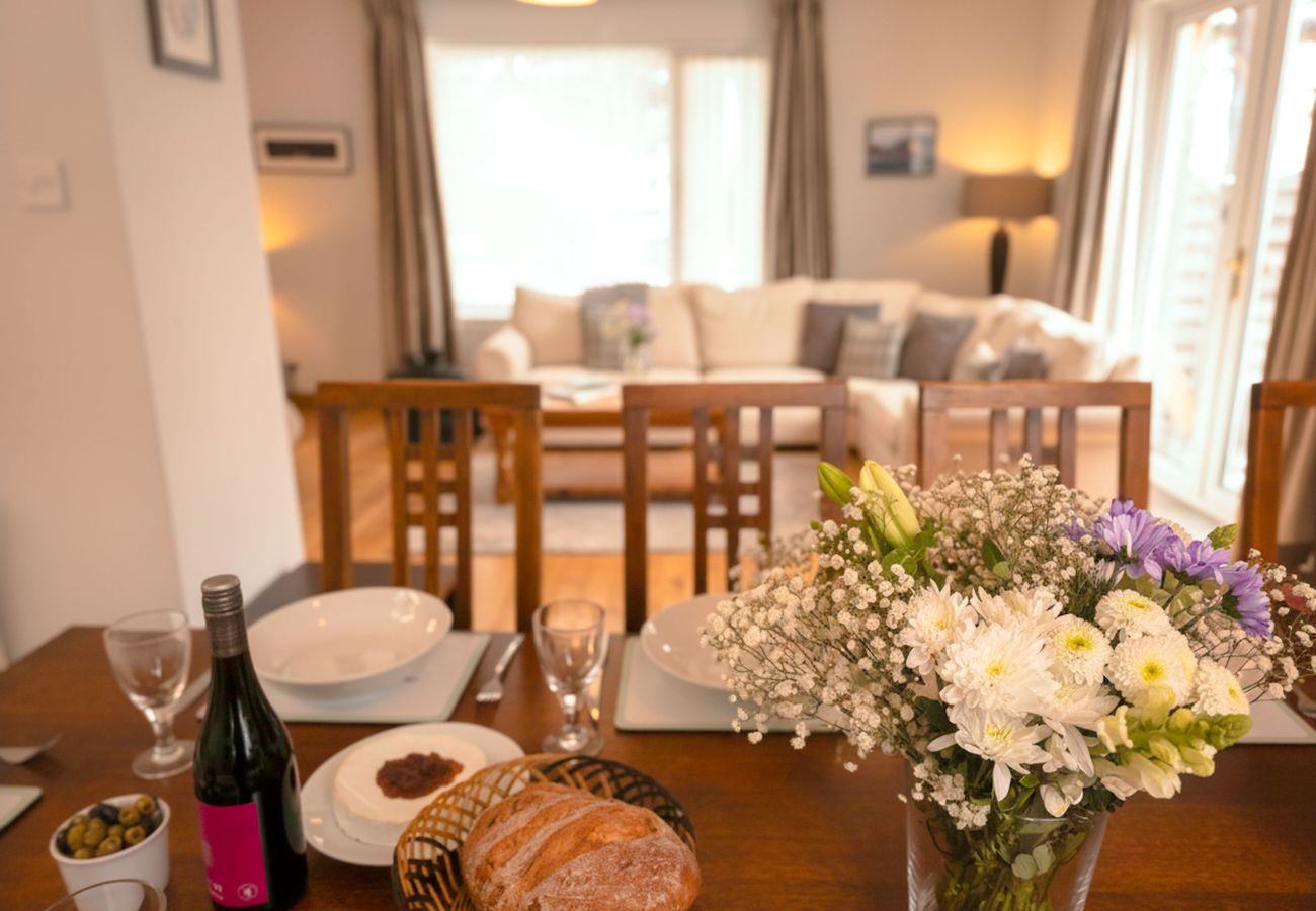 Dining table in bright open-plan room