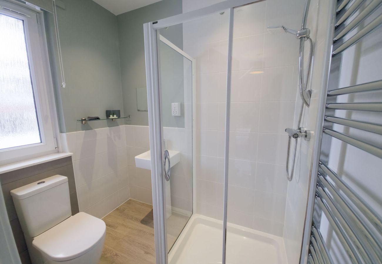 Shower room with glass enclosure