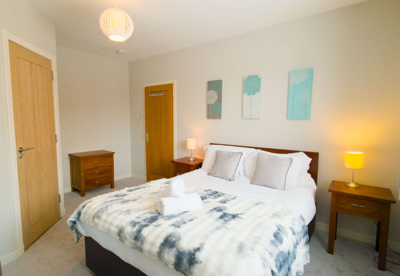 Double bedroom with artwork and soft decor