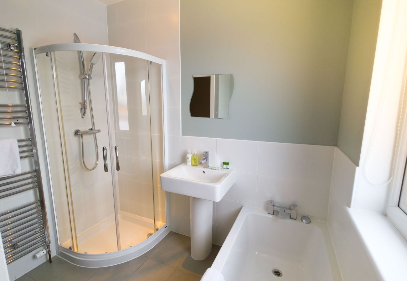 Bathroom with shower and bath