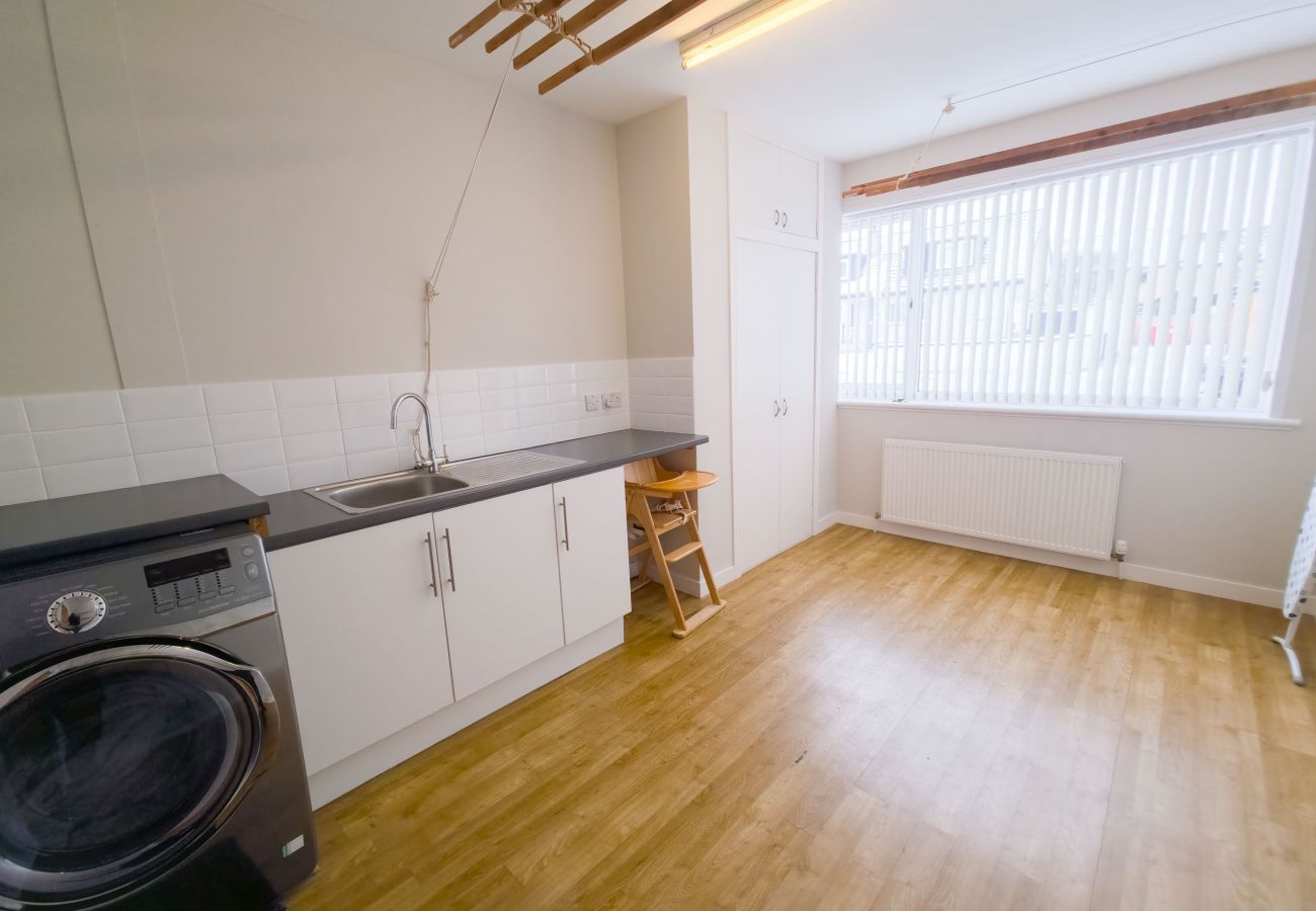 Utility area with storage and laundry