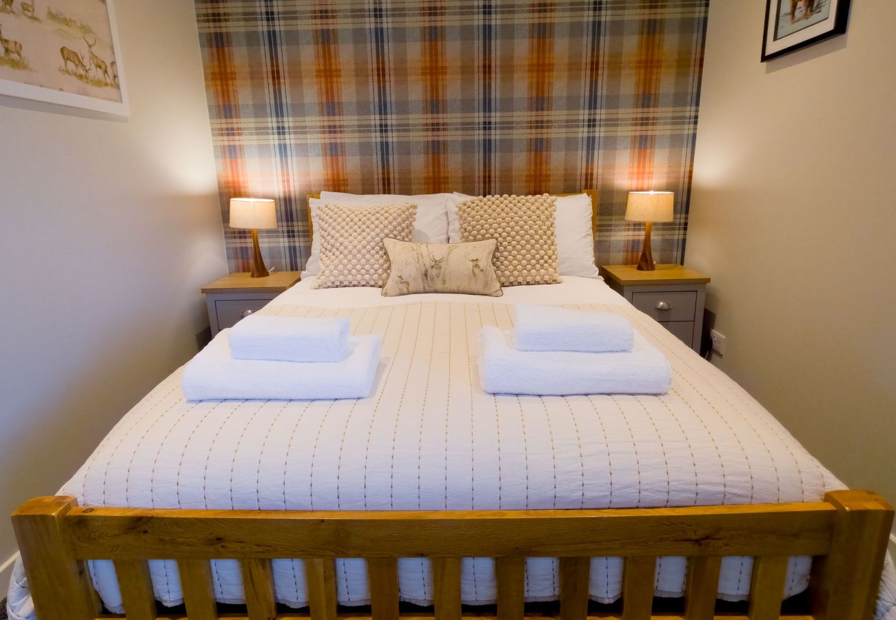 Double bedroom with stylish tartan touch