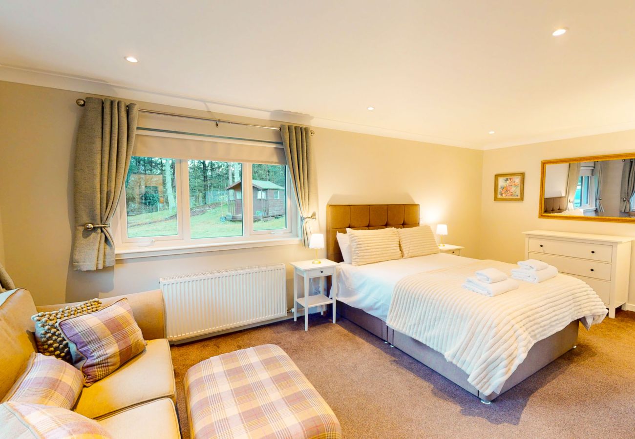 A stylish master bedroom with a king-size bed 