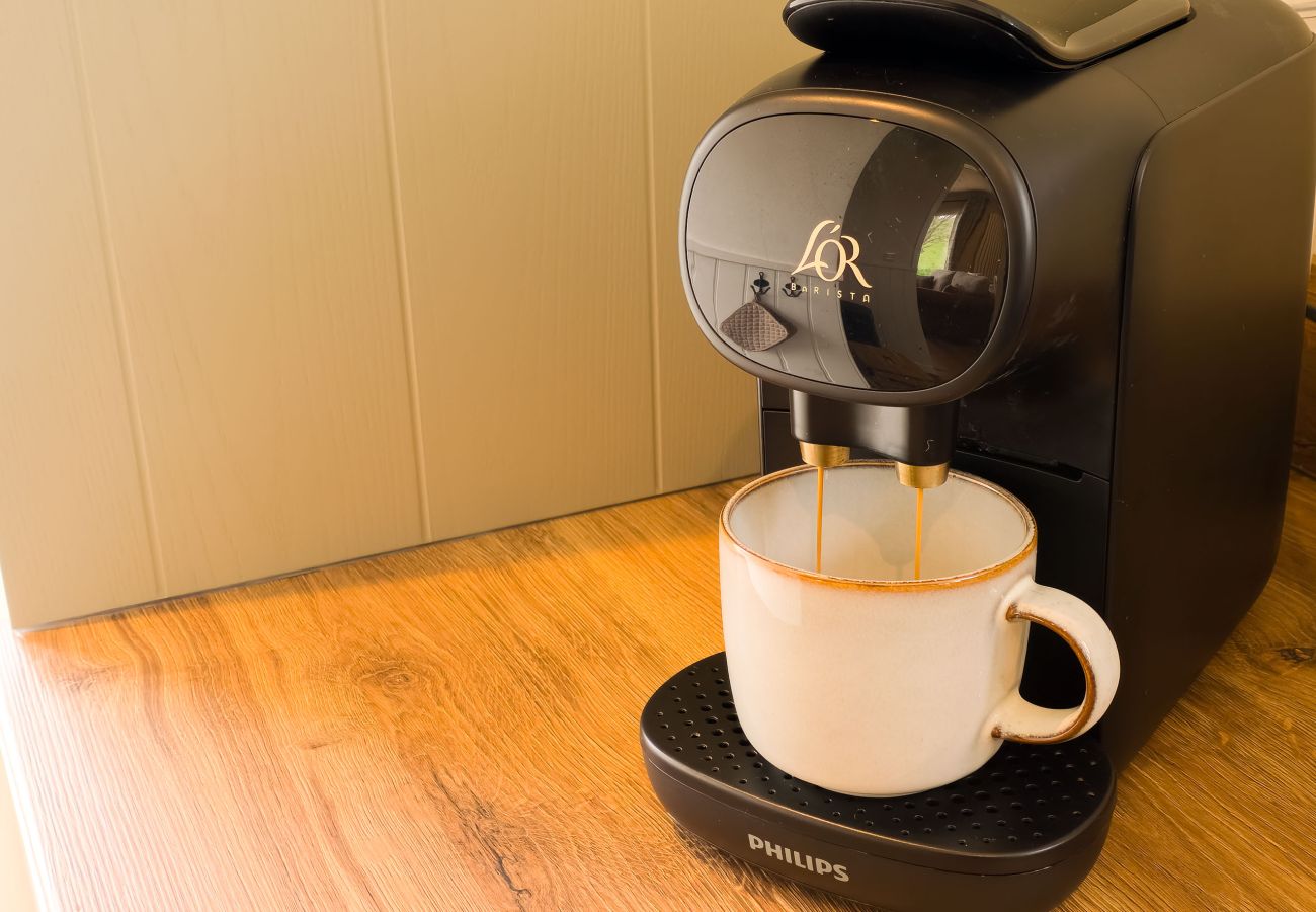 Coffee machine brewing in the kitchen at Betty's Cottage, Scottish Highlands self-catering