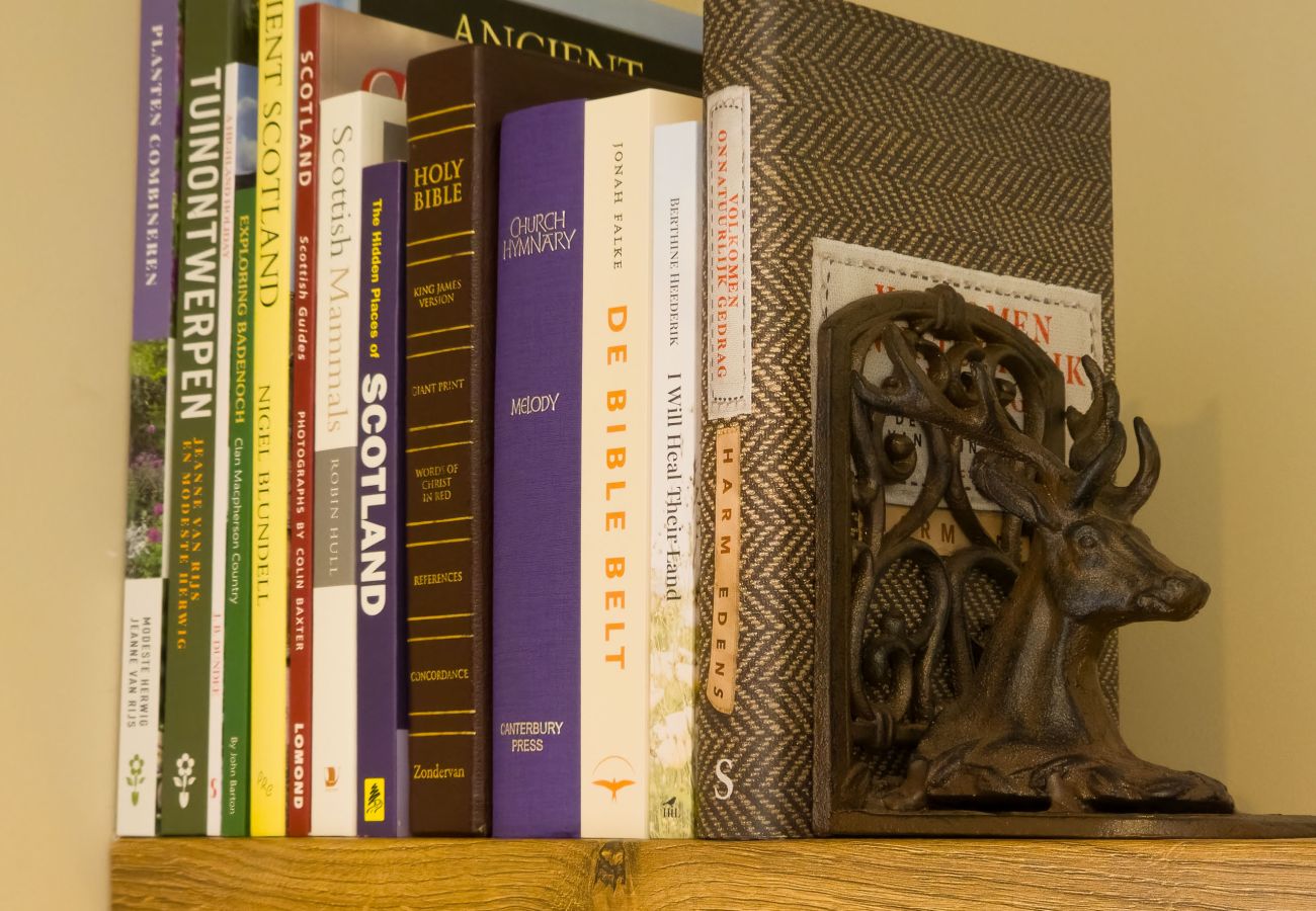 Scotland guidebooks and Highland deer bookend at Betty's Cottage self-catering