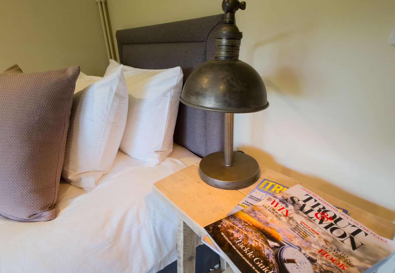 Bedside lamp and Highland guides at Betty's Cottage, Scottish Highlands self-catering