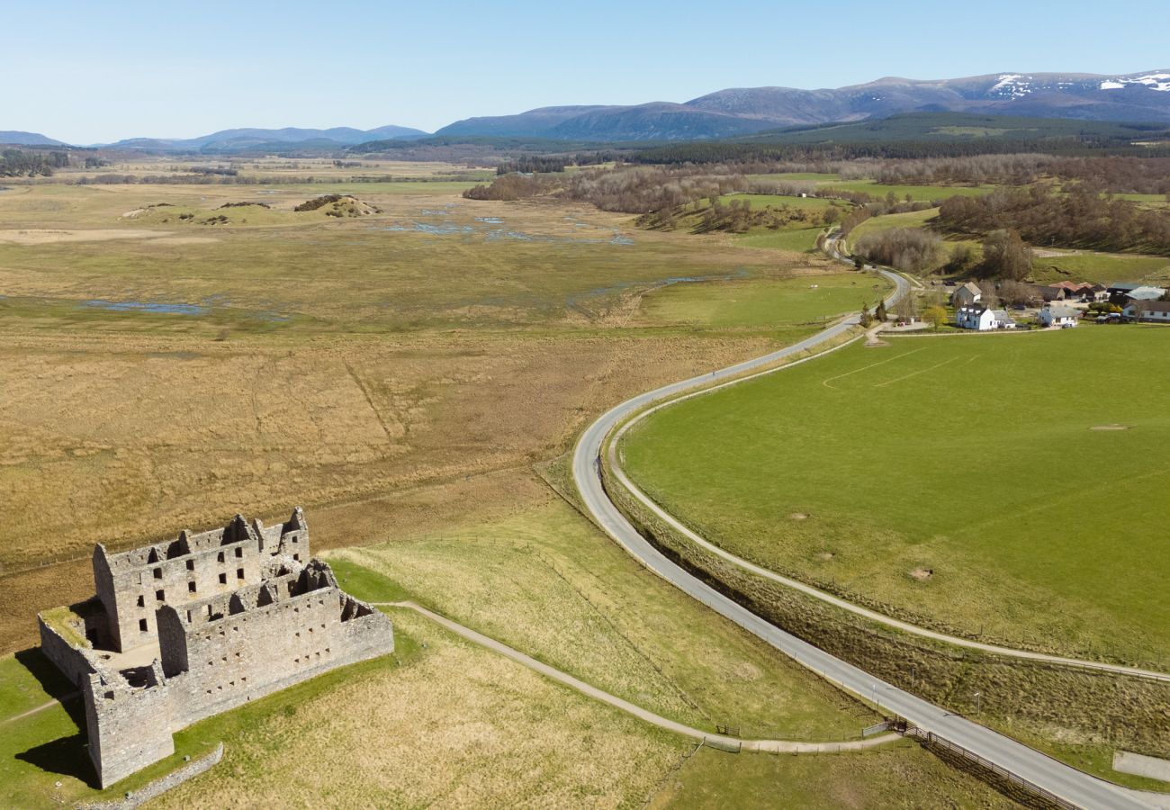 Aerial view of Ruthven Barracks ruins next to Betty's Cottage, Scottish Highlands