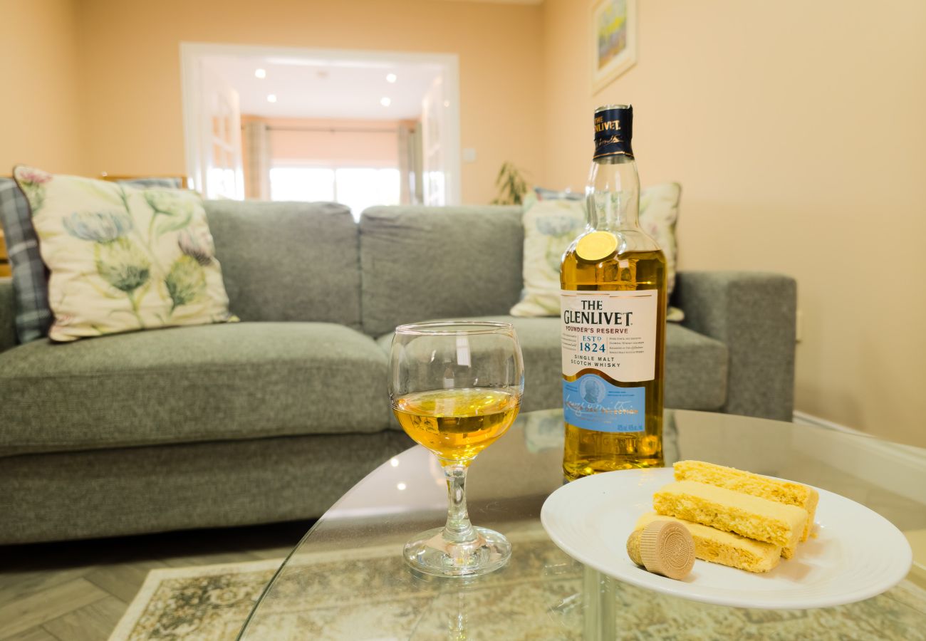 Comfortable grey sofa and lounge area at Inverness Crown holiday rental