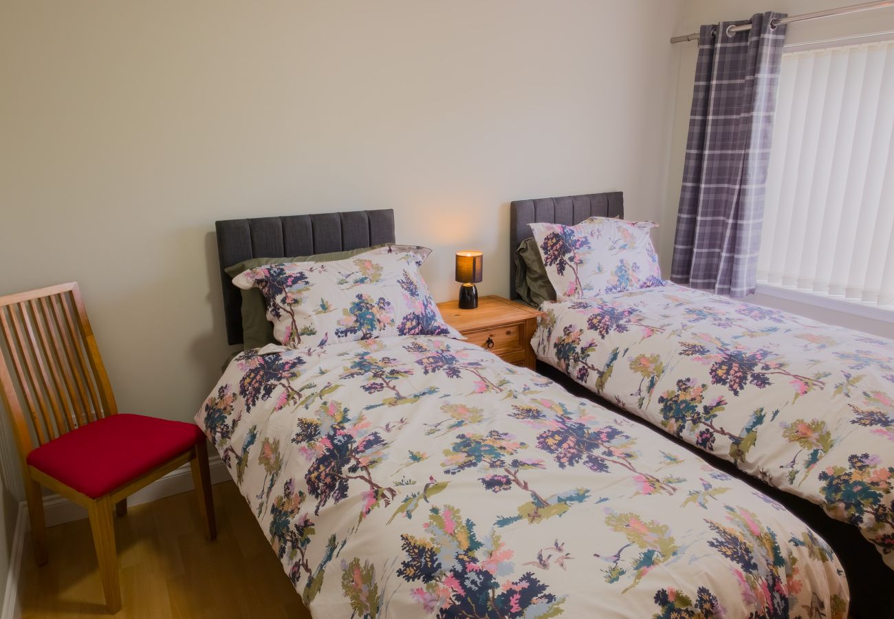 Twin bedroom with floral bedding at Inverness Crown holiday rental