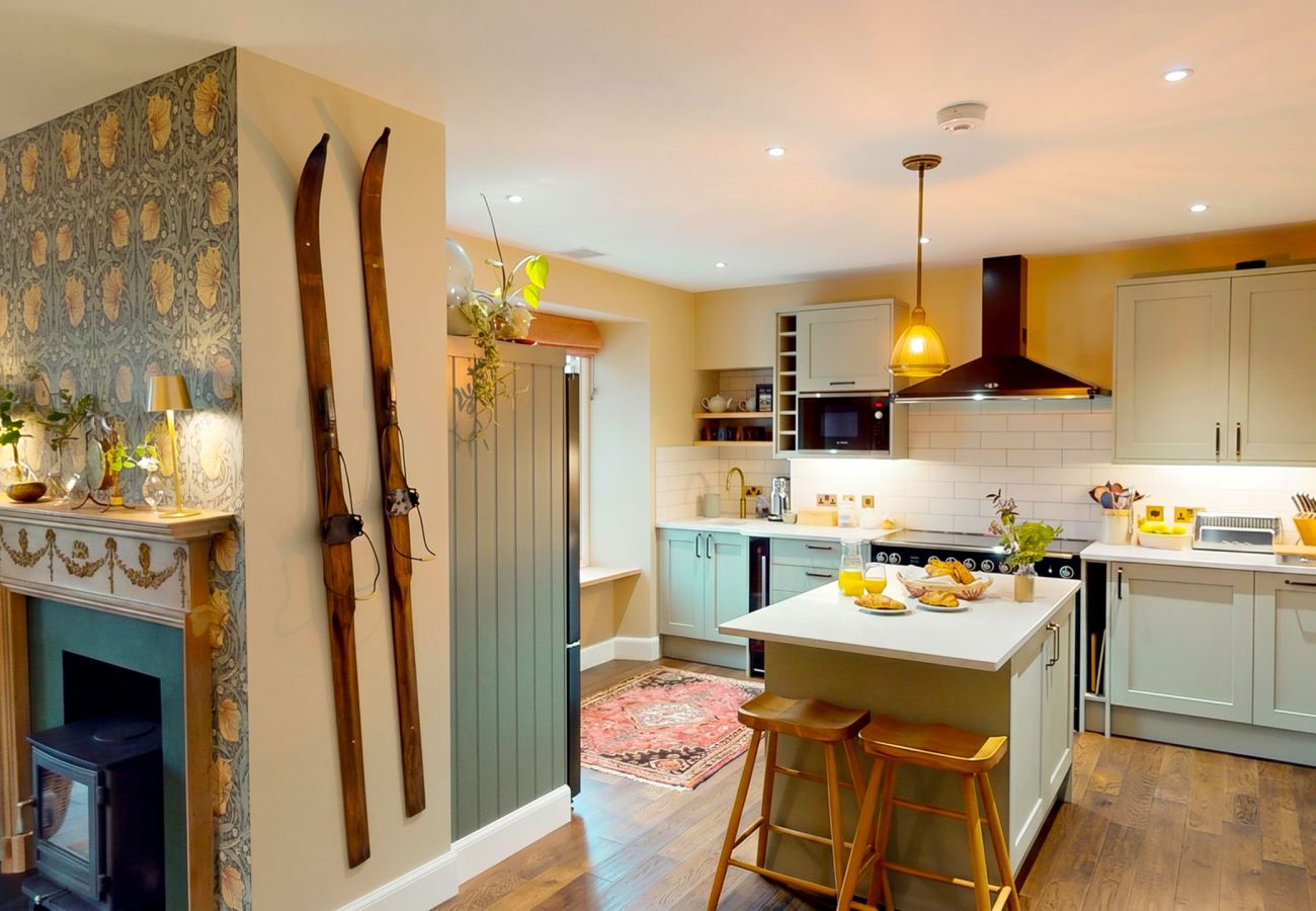 Spacious kitchen with central island and modern appliances at Lynwilg House Highland holiday home