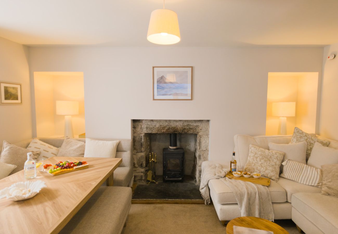 Open plan living and dining room with wood burner at Twinflower townhouse in Grantown-on-Spey, Cairngorms